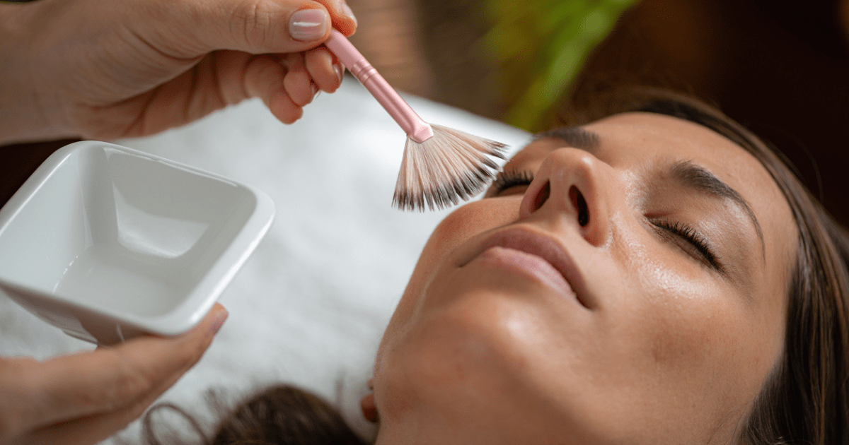 facial peel being applied to a women's face