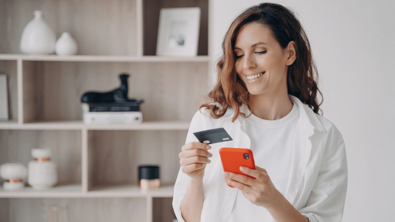 Girl is booking or purchasing online.